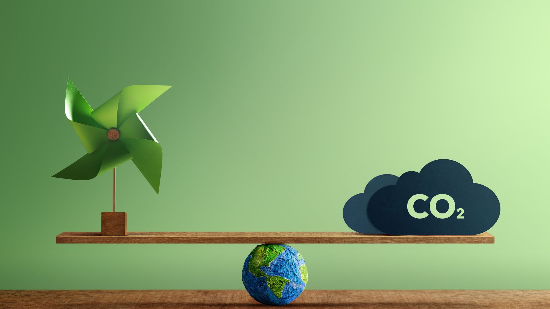 Scale of the earth weighing carbon and a green fan